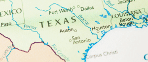Close-up map of Texas highlighting major cities such as Austin, Dallas, Houston, Fort Worth, and San Antonio, with clear state borders and surrounding regions, visually representing the geographic focus for commercial solar panel recycling services.